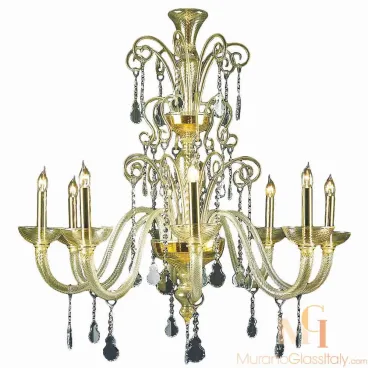 Golden modern Murano glass chandelier lighting fixture with curved arms and teardrop crystal ornaments.