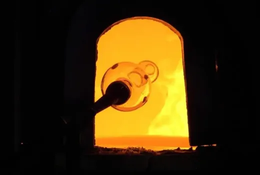 furnace Glass bottle in a furnace for making glass during demonstration at a Murano glass factory in Murano. Photography by Wknight94.