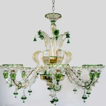 Custom crystal chandelier with green accents, hand-blown glass arms, and floral details, featuring an elegant tiered design.