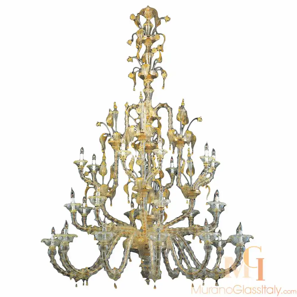6003-L12+8+8-D2-for-upload Murano Venetian chandelier with an ornate golden glass structure, detailed scrollwork, and tiered design featuring hand-blown floral elements.