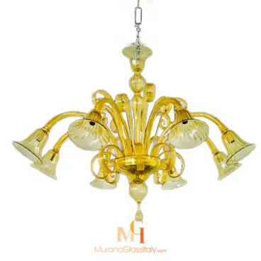 Modern blown glass chandelier in amber yellow with curved arms, fluted bell shades, and ornate scroll accents.