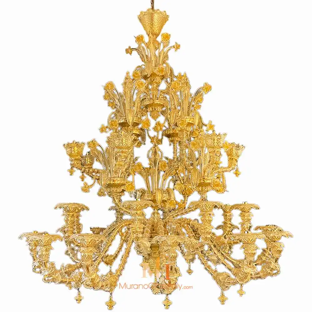 Esclusivo - Amber Murano Glass Chandelier Amber Murano glass chandelier with elaborate floral and scroll designs, featuring multiple arms and a highly detailed tiered structure.