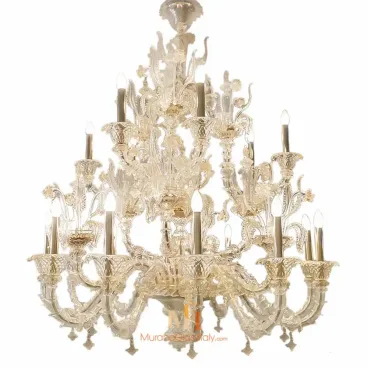 Venetian Murano chandelier with intricate clear glass arms, floral detailing, and multiple candle-style bulbs arranged in a grand tiered design.