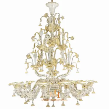 Murano glass light fixture featuring clear and gold floral elements, with curved arms, hanging accents, and an elegant tiered structure.