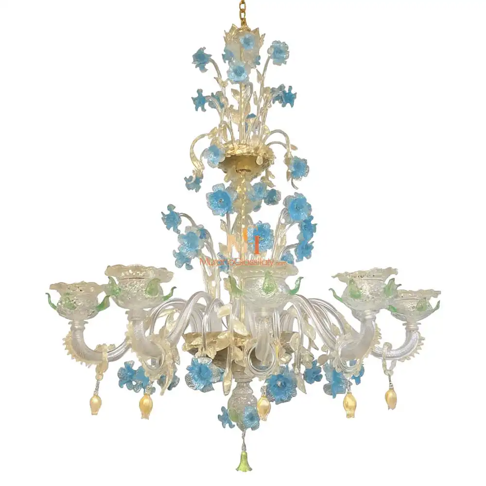 Ducale - Hand Blown Chandelier Hand-blown Murano chandelier from Venice with clear glass arms, light gold accents, and blue flowers with green leaves.